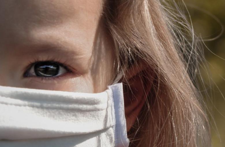 Little girl wearing face mask